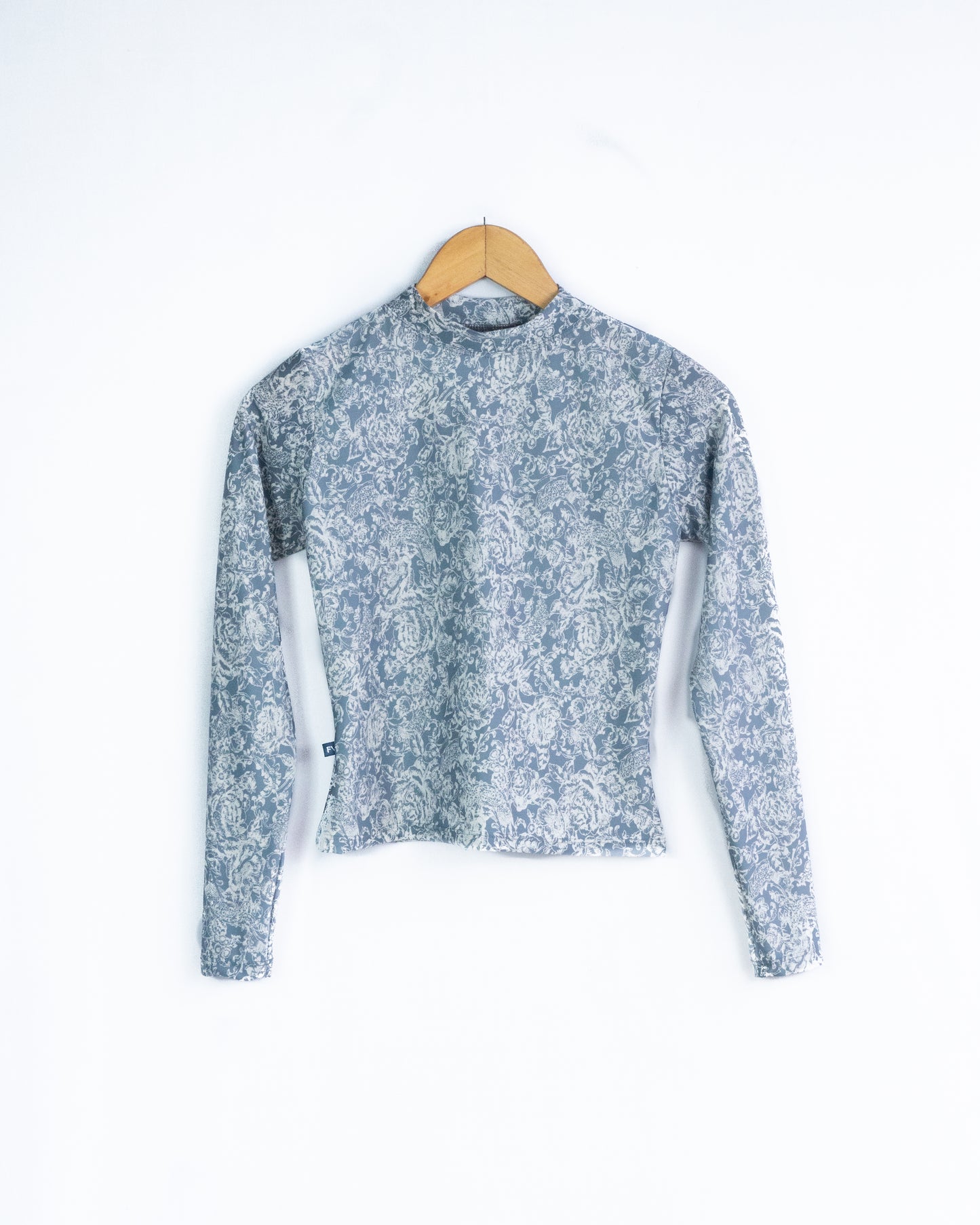 Rashguard Gris con flores blancas